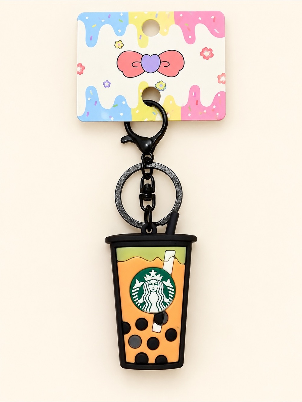 Black and orange fashion bag charm with Starbucks logo